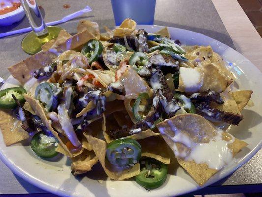 Jalisco Fajitas Nachos.  I added fresh jalapeños.