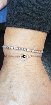 14k White Gold permanent jewelry bracelet with heart charm and cz center stone.