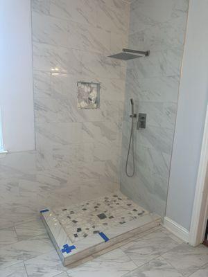 Cracked shower tile yet to be completed