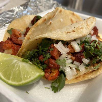 Al pastor on homemade corn tortillas