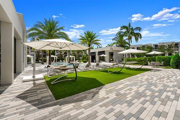 The expansive sundeck features hammocks and cabanas