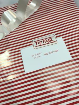 12/23/15. Gift wrapped in Toy Fair iconic candy cane wrapping paper!