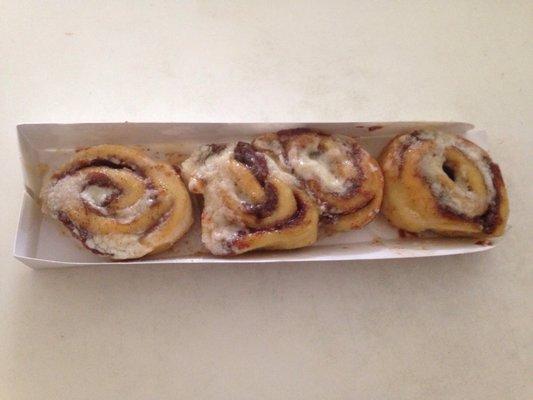 Four mini cinnamon buns.