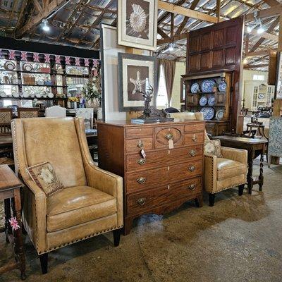 Chloe leather arm chair with nail head trim on tapered legs upholstered in Bedford Branston leather.