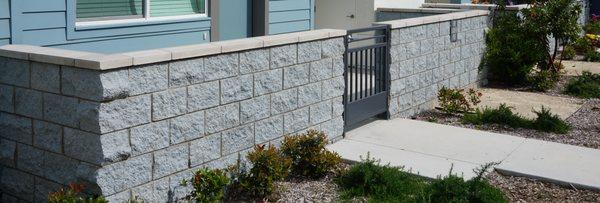 Masonry split face cmu block walls with precast cap