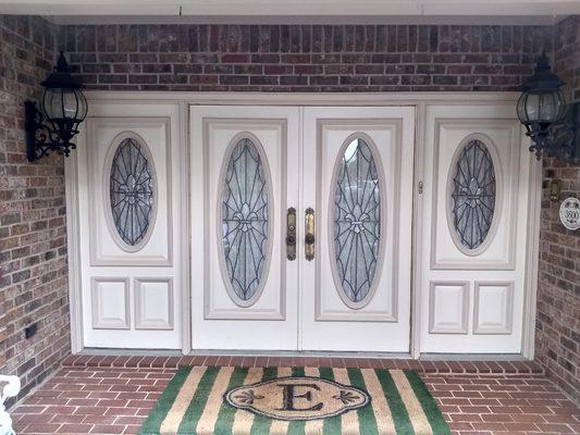 Front door that we removed all paint from, then primed and painted two different colors.