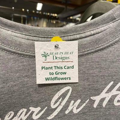 This shirt has a hang tag that you can plant to grow wildflowers.