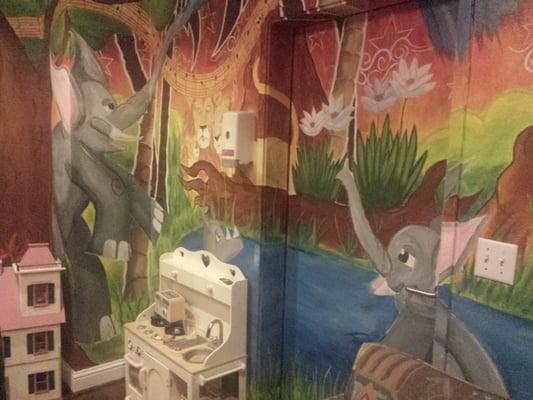 Kids play room. A man painted the mural himself in dedication to RMH helping out his family