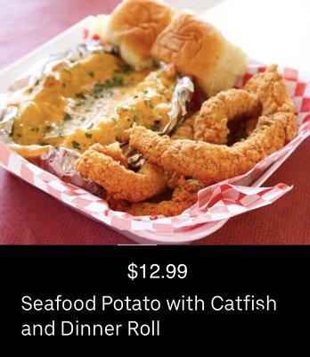 Seafood Baked Potato with Fried Catfish and dinner roll.