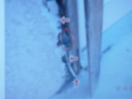 nonlicense contractor ran wires under metal threshold than brake out stucco wall to run wire n leaves exposed to weather.