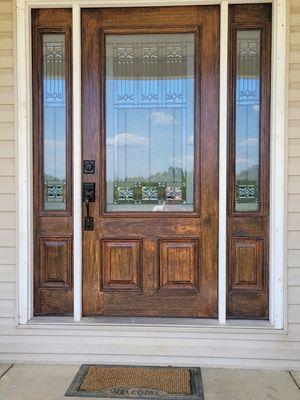 Wood door, stripped, sanded, multiple layers of stain and clear coat.