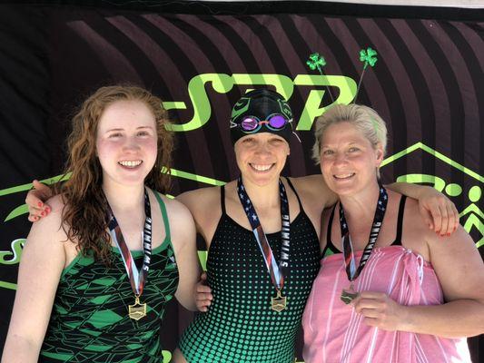 Three ladies, three ages groups, three 100 breaststroke races (same heat!), and three 1st Place Medals!