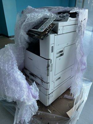 Damaged copier by R & L Carriers