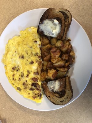 Bacon and steak omelette with our amazing home fries!