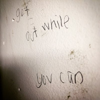 graffiti seen in classroom: "get out while you can"