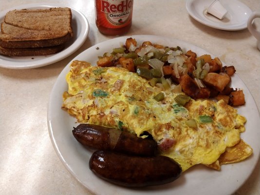 Western omelet with side of sausage.