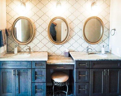 This is the type of bathroom vanity we all dream of! With his-and-hers sinks, lots of light, and a touch of class!