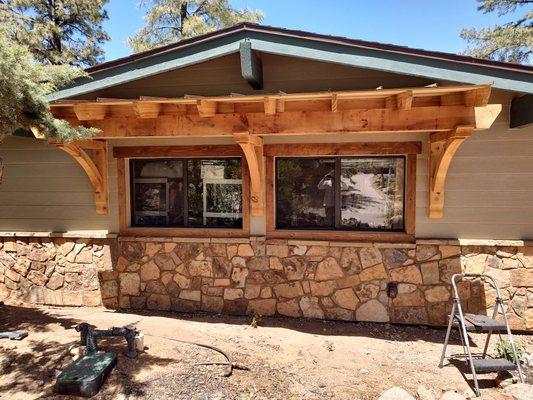 Exposed eyebrow awning over double windows