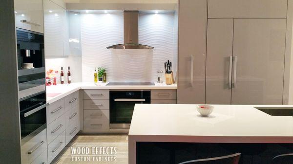 Custom built modern kitchen adds streamlined functionality.