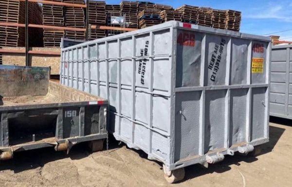 The 40-yard dumpster is a large, rectangular container designed for high-capacity waste disposal. Measuring approximately 20 feet in length.