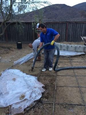 Poured the first 10 yards of cement in the backyard for the new seating area.