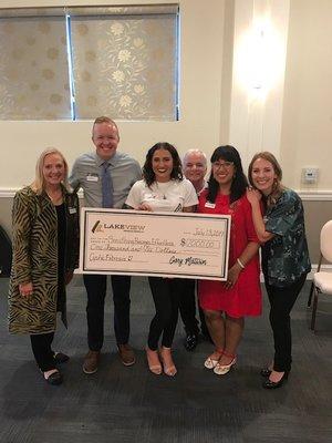 Mattson Financial prides themselves on giving back! Here is our team with one of our ACE (Annual Charity Event) winners in 2019