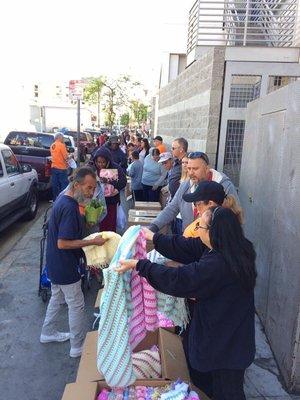 Knitted quilts are given to the people living on the streets