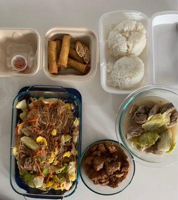 Clockwise: Pork lumpia, complimentary white rice, pork sinigang, pork adobo, pancit guisado.