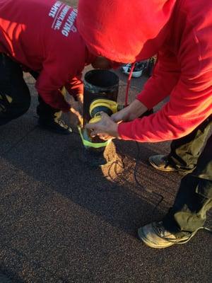 sanding the chimney in preperation for a sleeve kit