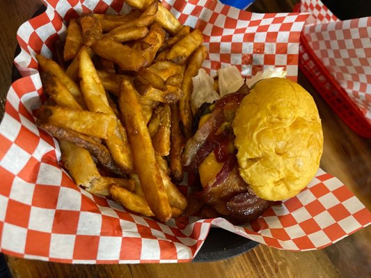 Classic American burger with bacon and jalapeños. Side of battered French Fries