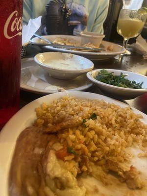 Beans and rice with cilantro in the back and margarita