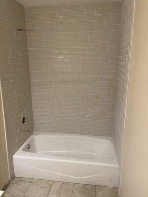 Tile above tub