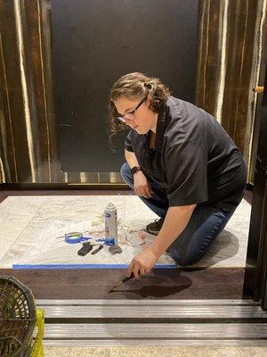 Elevator floor touch-up.