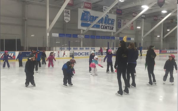 A skating lesson on Dedham ice.