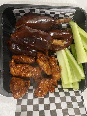 Sizzling Smoked Wing platter. Delicious smoked chicken wings and Pork Shanks smothered in our homemade bbq sauce.