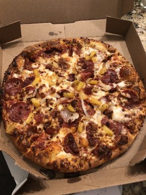 Medium hand tossed pizza with pepperoni, bacon, onions, pineapple, and extra cheese