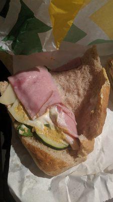 Ham, turkey, Swiss cheese, spinach, cucumbers, mayo, mustard...I asked for vinegar and oil but I think he forgot that?