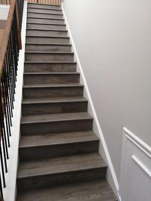 Step renovation, old carpet replaced by vinyl flooring