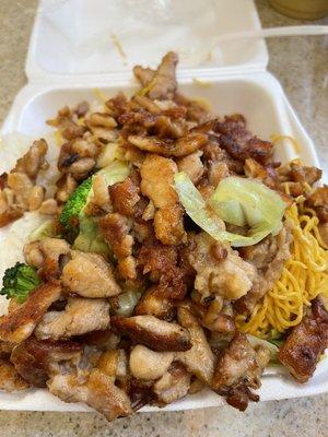 Chicken teriyaki plate with veggies. Half rice and half noodles.