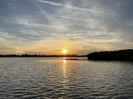 Sun setting over Mernard-May park in the distance