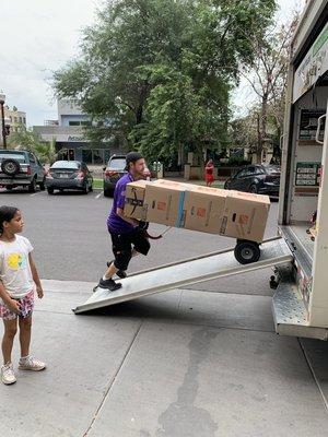 Kyle loading the moving truck - Hickle Family Moving