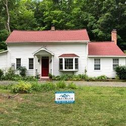 Arctic White James Hardie Fiber Cement Siding. GAF Patriot Red roofing shingles. www.infiniteroofingny.com