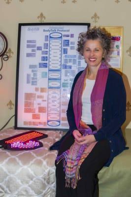 Mollie with the International BodyTalk Association poster and LED lights.