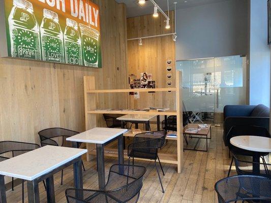 Interior of Hudson St juice press store  Lots of seating, natural light, aircon