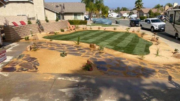 After.      Decomposed Granite, Sod, flagstone, plants, drip line, sprinklers