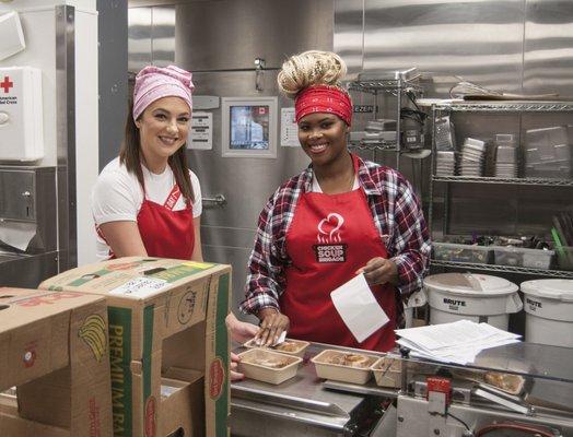 Lifelong can accommodate groups to volunteer. Here are some folks packaging and labeling meals.