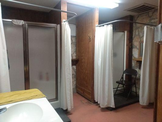 Women's bathroom with two showers and two toilets