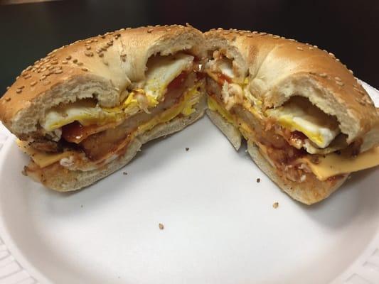 Egg and cheese on a toasted sea same bagel with hash brown in the center yum this is delicious.