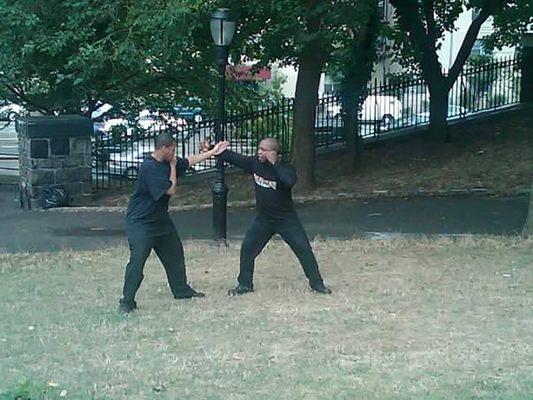 Training outdoors was fine. It's about learning the art, but a proper dojo should be available for the fee they are asking for.