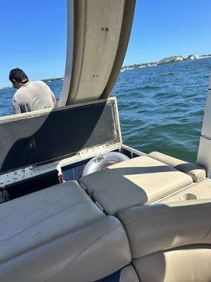 Captain urinating on boat.